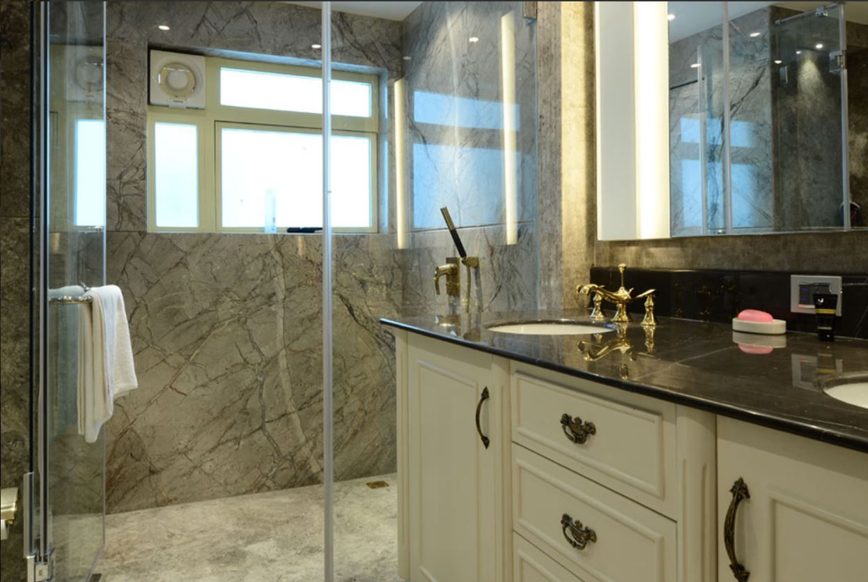 Master ensuite with bookmatched marble and brass fixtures