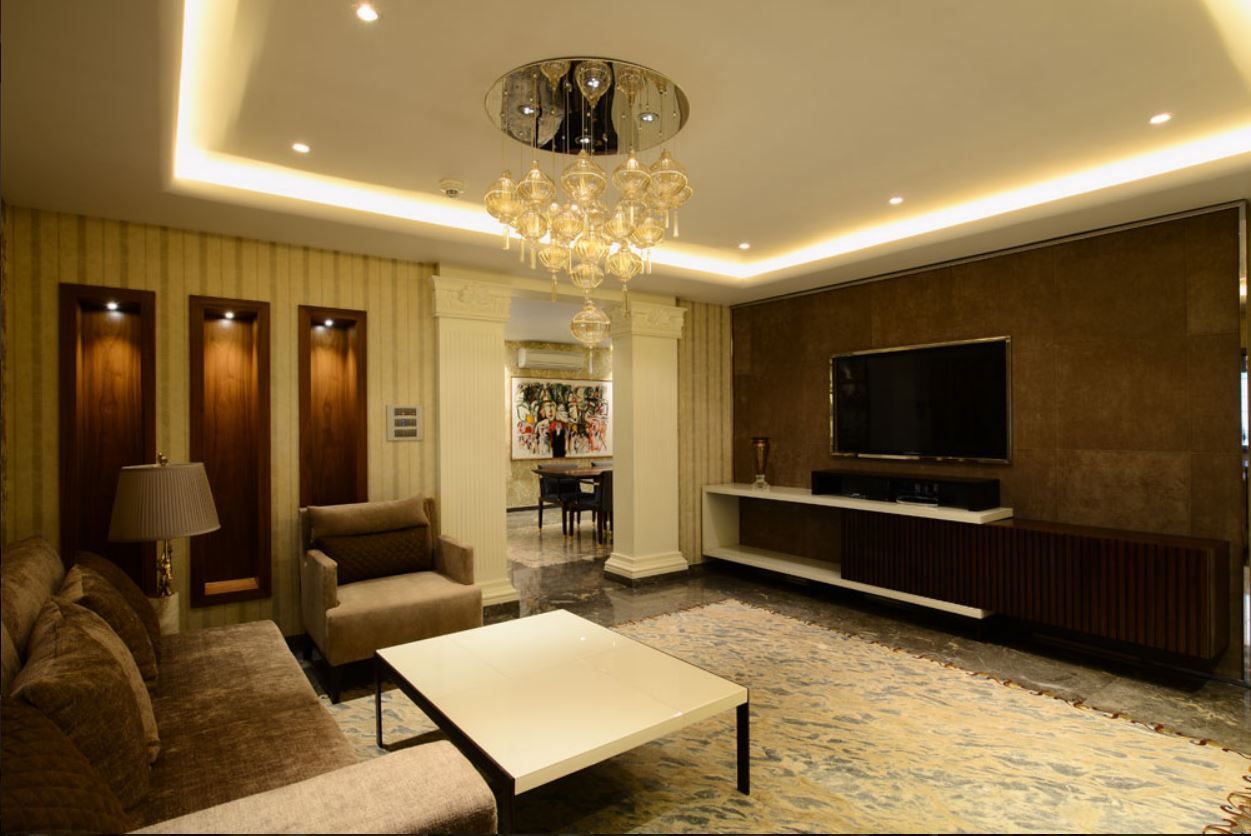 Family lounge with travertine media wall and recessed niches
